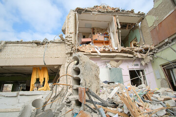 Zhytomyr, Ukraine - March 16, 2022: consequences of the bomb dropped on the school. Russian military attacks from the air. Sectional building view