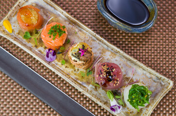 Platter decorated with different flavors of elegant gunkan sushi