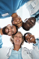 Fototapeta na wymiar Working cohesively to provide quality healthcare for all. Portrait of a group of medical practitioners standing together in a huddle.