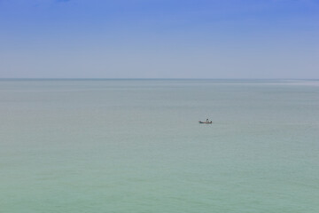 A boat in the middle of the sea