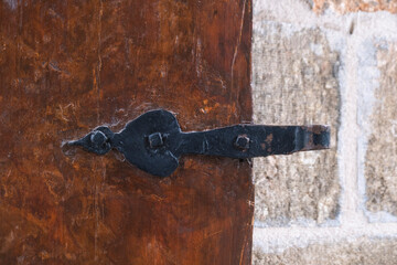 metal hinge on old and historical wooden door