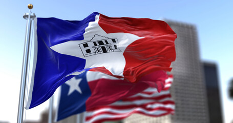 San Antonio city flag waving in the wind with Texas state and United States national flags