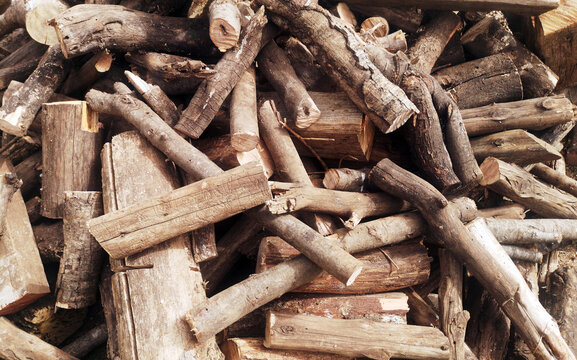 Pile of firewood loggs as background