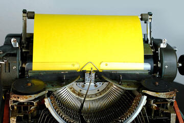 typewriter on table, words fake news are printed on paper in large size, vintage lantern shines,...