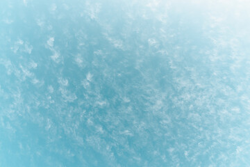 A cloudy blue sky background.