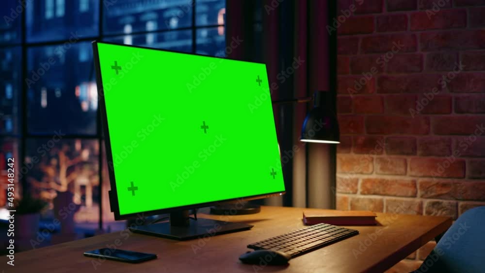 Poster desktop computer monitor standing on a table with a green screen chromakey mock up display. cozy emp