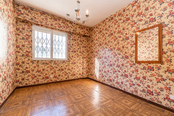 Room with wallpaper walls with vintage kitsch flowers and sintasol floors similar to wooden parquet...