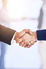 Congrats. Shot of two businesspeople shaking hands.