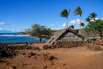 Reconstructed Hawaiian Hale facing the Pacific Ocean in the ancient fishing village in ruins of the...