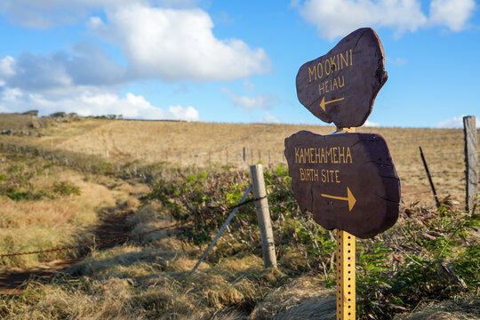 Direction signs to Mo'okini Heuiau and Kamehameha birth place in the north of Big Island, Hawaii - Coastal trail in the Kohala Historical Sites State Monument near Upolu Point