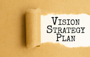 vision strategy plan words written under torn paper.