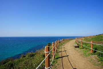 Fototapeta na wymiar fine seaside walkway and clear bluish sea