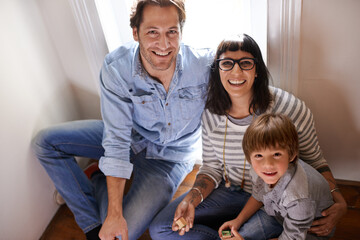 Family bliss. A mother and father sitting with their son.