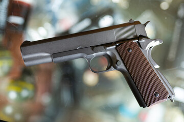 Pneumatic weapon on the glass table in army store