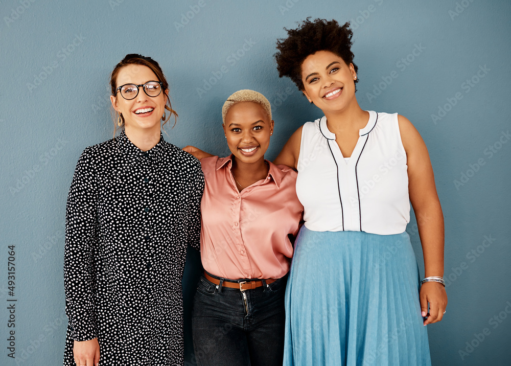 Canvas Prints Were such a happy team. Studio portrait of a group of attractive young businesswomen smiling while standing together against a grey background.