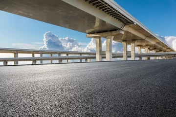 Keuken spatwand met foto Empty asphalt road and bridge building background © ABCDstock