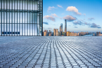 Fototapeta premium Empty square floor and city skyline with buildings in Shanghai at sunset, China.
