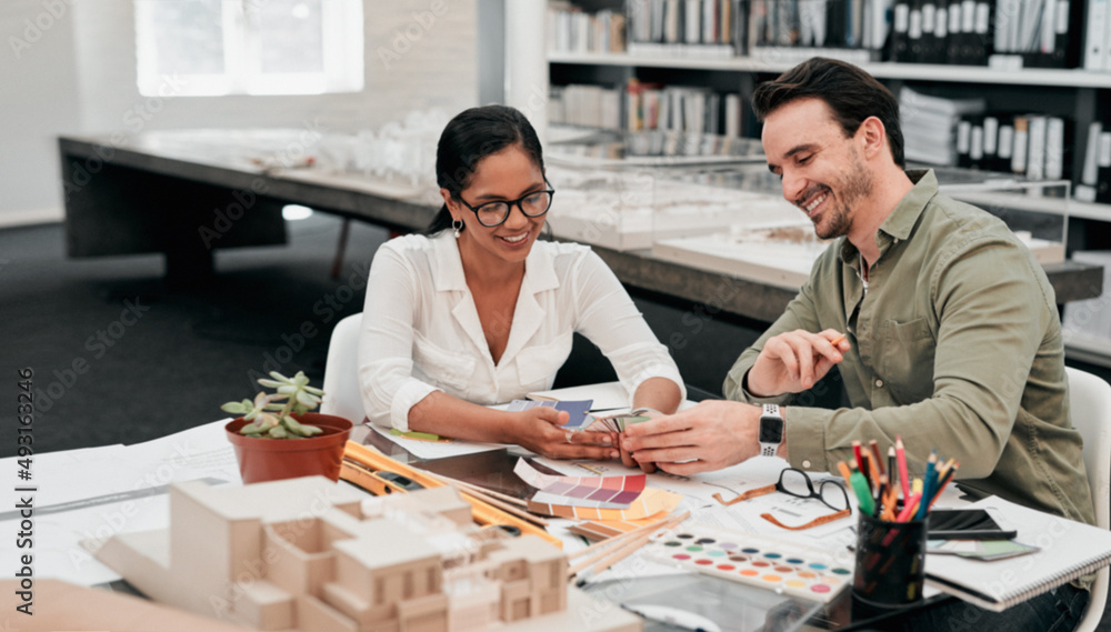 Aufkleber Just take a look at this. Cropped shot of two aspiring young architects smiling while working together in a modern office.