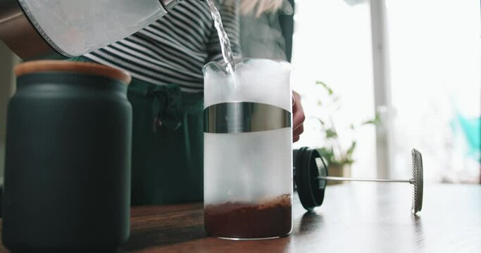 Girl is making coffee at home