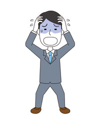 頭を抱えてあせる男性