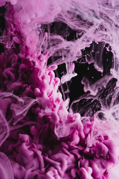 Pink colorful ink drop in water, Ink swirling in. abstraction image for background or color referent.