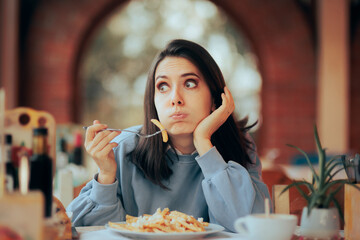 Stressed Woman Overeating a Large Portion of French Fries 