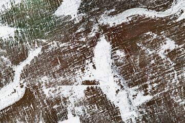 abstract colorful creative background - rough linen canvas unevenly covered with multi-colored primers, reflections of light. Toning, blur. Temporary object.