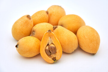 Ripe loquat on a white background
