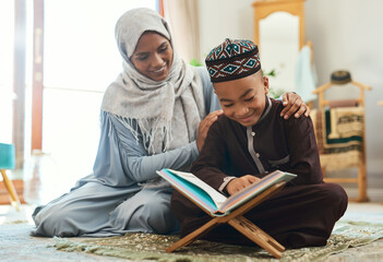 Love is the supreme form of communication. Shot of a young muslim mother and her son reading in the lounge at home.