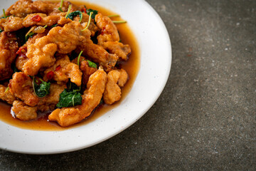 stir-fried fried fish with basil and chili in thai style