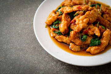 stir-fried fried fish with basil and chili in thai style