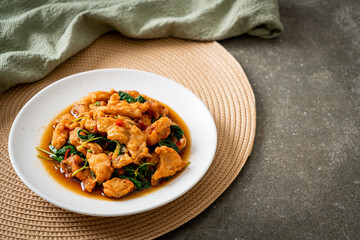 stir-fried fried fish with basil and chili in thai style