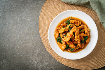 stir-fried fried fish with basil and chili in thai style