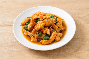 stir-fried fried fish with basil and chili in thai style
