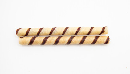 three wafer rolls with chocolate isolated on white background