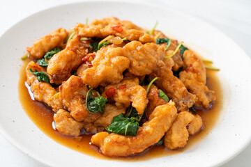 stir-fried fried fish with basil and chili in thai style