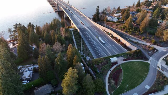 Cinematic 4K aerial drone reveal shot of the Evergreen Pt floating bridge, Laurelhurst, Lake Washington 520 bridge view park