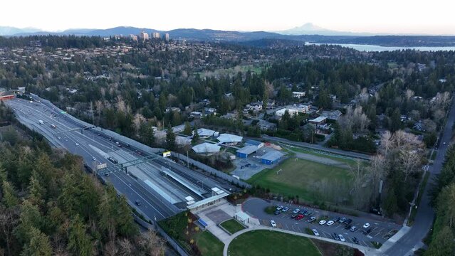 Cinematic 4K aerial drone footage of 520 bridge view park, Medina, Hunts Point, Yarrow Point, Clyde Hill, Evergreen Pt floating bridge with, Lake Washington mansions, luxury homes, villas
