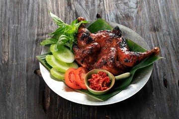 Ayam Bakar Bakakak or Whole Roasted Chicken with Sweet Soy Sauce, Served with Sliced Cucumber,...