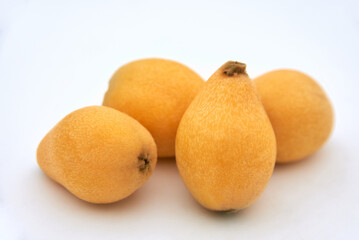 Ripe loquat on a white background