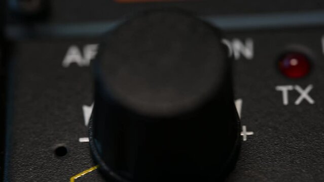 slider runs over the controls of a portable HAM radio used for communication of last resort