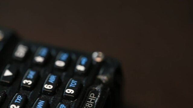 keyboard and lit channel indicator of a modern handheld HAM radio suitable for close communication