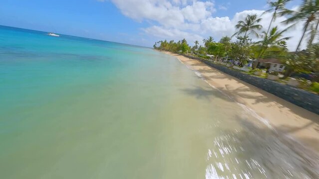 FPV drone flight along stunning tropical coastline of Playa Punta Popy