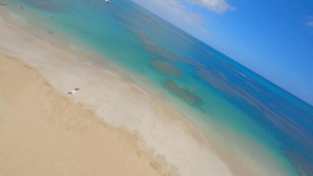 Gorgeous azure blue Caribbean sea with leisure boats; Punta Popy beach