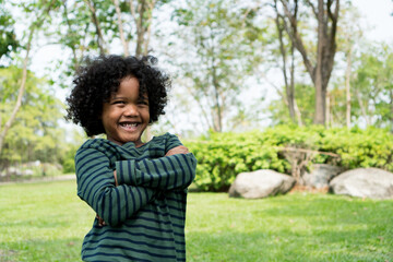child little boy happy smile and laugh hair style afro relax in weekend holiday lifestyle park.
