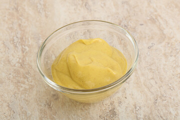 Organic mustard sauce in the bowl