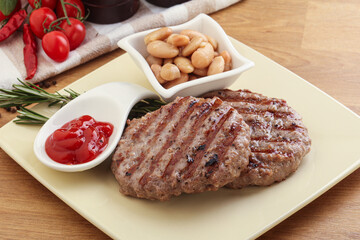Grilled beef burger cutlet with sauce