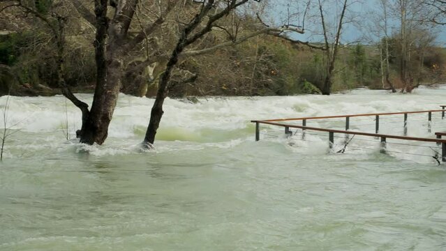 stormy river floods tourist base in Turkey