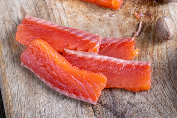 red salted salmon fish meat on a chopping board