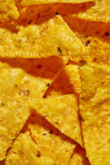 Flat lay macro nacho chips, Background of Corn Tortilla Chips